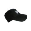 A black hat with the word " mom " on it.