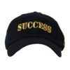 A black hat with the word " success " on it.