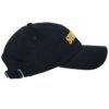 A black hat with a yellow patch on the side.