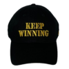 A black hat with the words " keep winning ".
