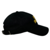 A black hat with a yellow logo on it.