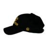 A black hat with yellow writing on it.