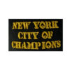 A black and yellow patch with the words new york city of champions.