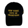 A black hat with yellow writing on it.