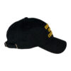 A black hat with yellow writing on it.