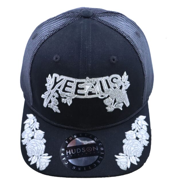 A black hat with white flowers on it