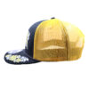 A black and yellow hat with flowers on it