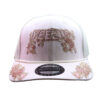 A white hat with pink flowers on it