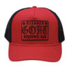 A red and black hat with a patch on it