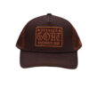 A brown hat with an orange patch on it