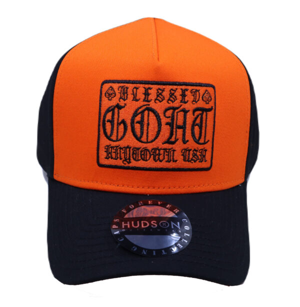 A black and orange hat with an old english lettering.