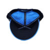 A blue and black hat is on the ground