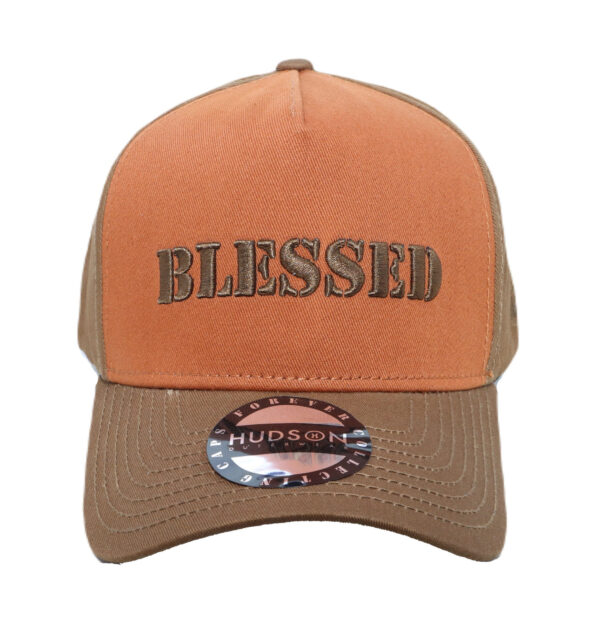 A brown and orange hat with the word blessed on it.