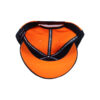 A cap that is open to show the inside of it.