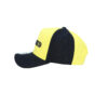 A yellow and black hat with the word " yolo ".