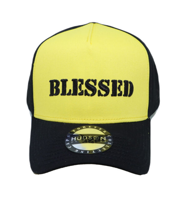 A yellow and black hat with the word blessed on it.