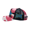 A pink and black hat with a blue and yellow design.