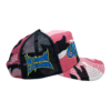 A pink and black hat with the words " national convention " on it.