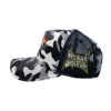 A black and white camo hat with an orange logo.