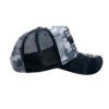 A black and white camo hat with a patch on the side.