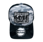 A black and white camo hat with a patch on it.