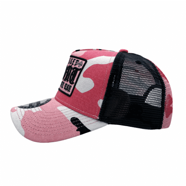 A pink and black hat with a patch on it