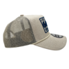 A beige hat with a patch on the side of it.