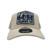 A white hat with a blue patch on it