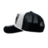 A black and white hat with the words " new york " on it.
