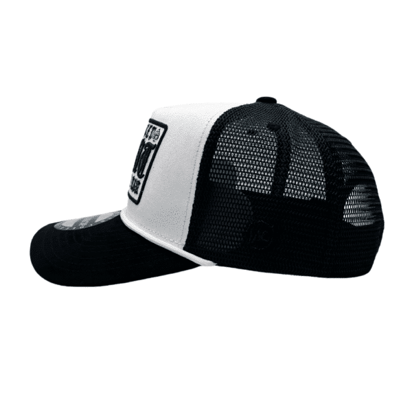 A black and white hat with the words " new york " on it.