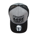 A black and grey hat with a patch on it