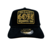 A black hat with gold lettering on it.