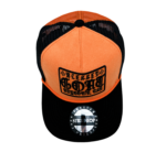 A black and orange hat with a logo on it.