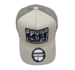 A white hat with a patch on the front of it.