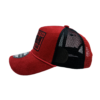 A red hat with black lettering on it.