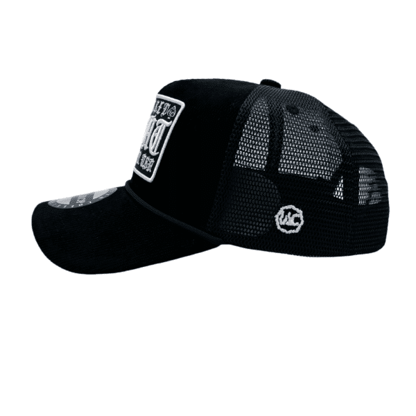 A black and white hat with a patch on it