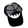 A black hat with a white and grey design on it.