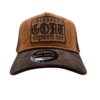 A brown and black hat with the words " gost " on it.