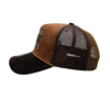 A brown and black hat with an embroidered patch.
