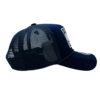 A navy blue hat with a white patch on the side.
