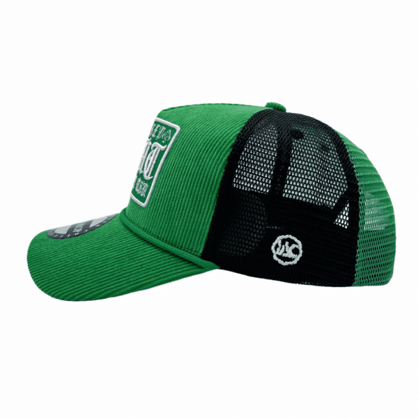 A green and black hat with a patch on it