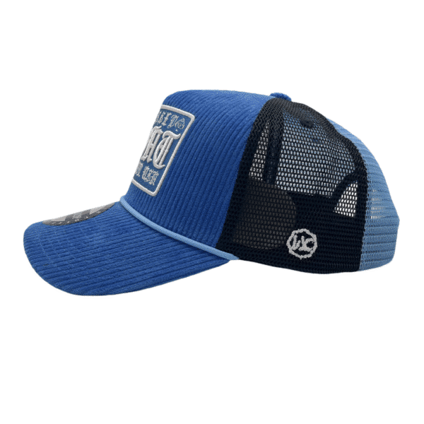 A blue and black hat with a patch on it
