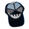 A black and white hat with a face on it