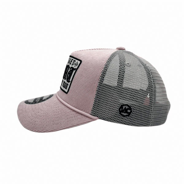 A pink and grey hat with a patch on it.