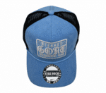 A blue and black hat with the words " blessed goat ".