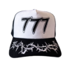 A black and white hat with the number 7 7 7 written on it.