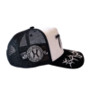 A black and white hat with a logo on it