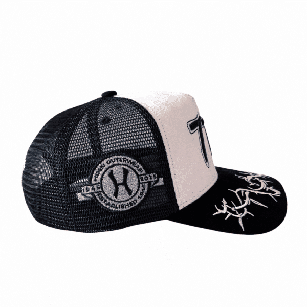 A black and white hat with a logo on it