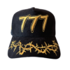 A black hat with gold lettering and yellow writing.