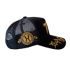 A black and gold hat with a logo on it.